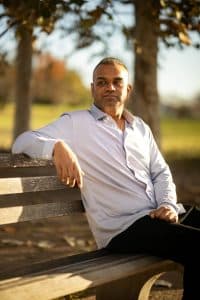 Dating profile photoshoot client sitting on bench in mueller park